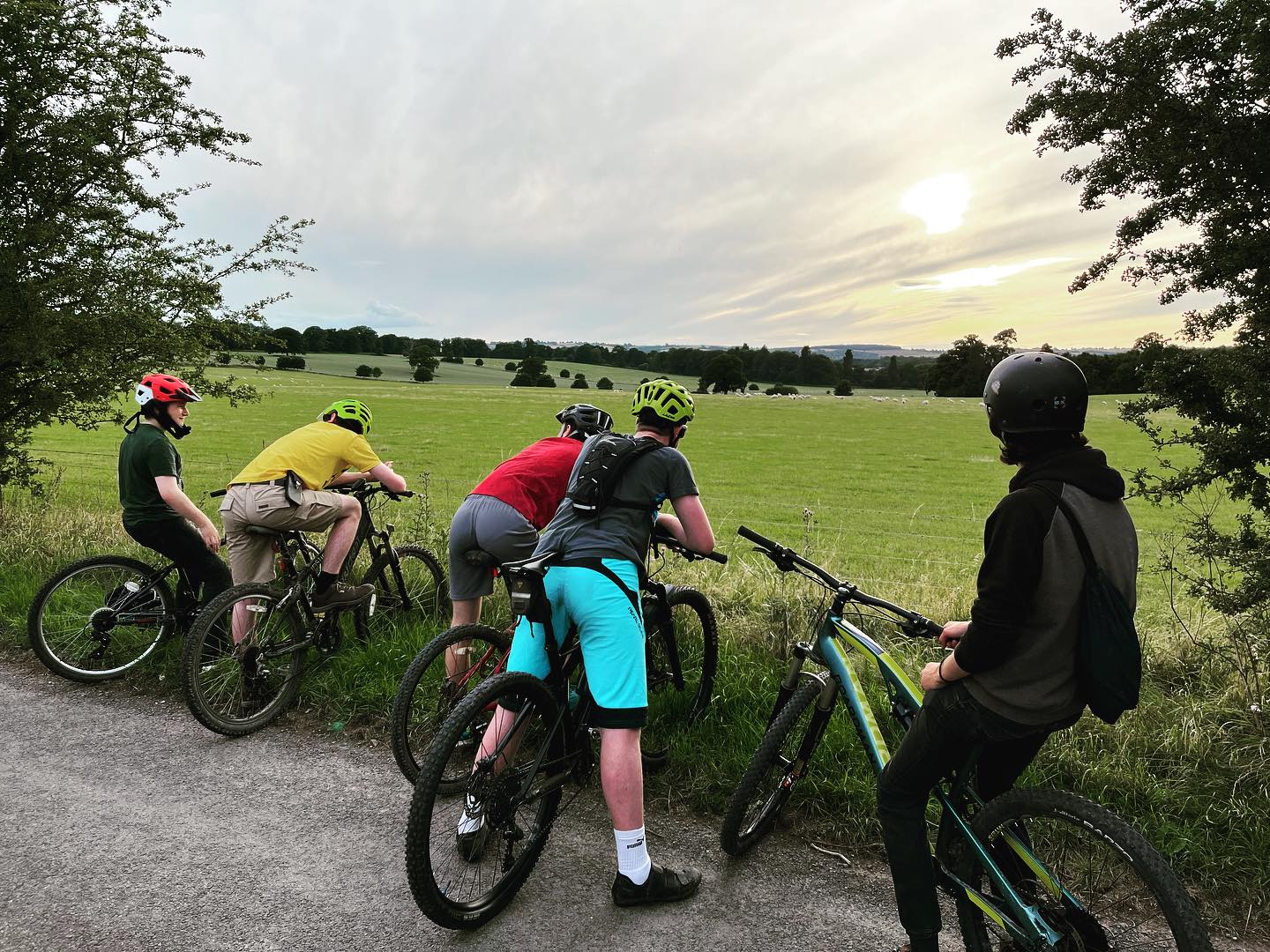 Triffid Explorers pausing to enjoy the sunset on a countryside bike ride